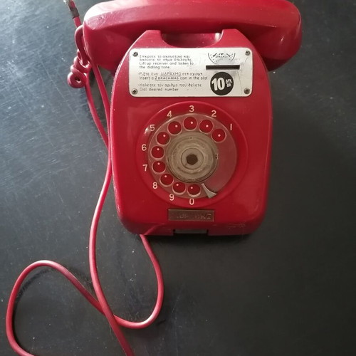 Vintage coin-operated telephone in like new condition
