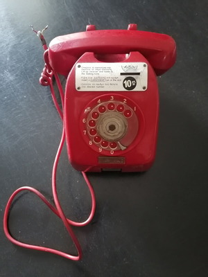 Vintage coin-operated telephone in like new condition