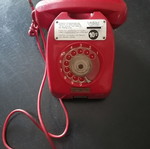 Vintage coin-operated telephone in like new condition