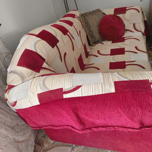 Two-seater sofa used with cover and cushions