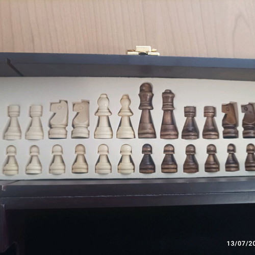Wooden wine case used with travel chess set