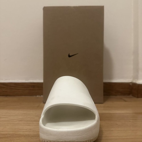 Nike men's white Calm slides size 42.5, used with signs of wear