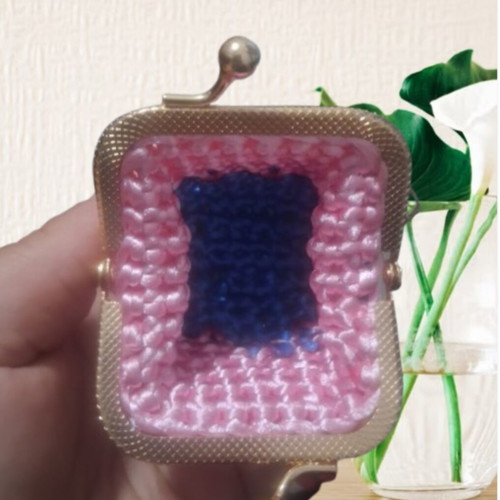Small handmade knitted wallets, red and pink
