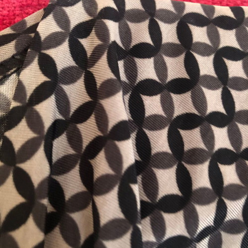 Draped dress used with geometric pattern in black and gray