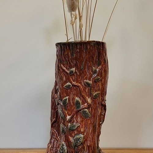 Handmade ceramic vase with natural decorative elements