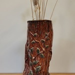 Handmade ceramic vase with natural decorative elements