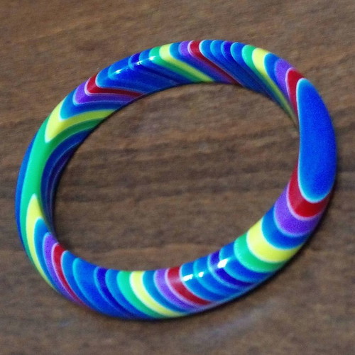 Set of 7 used neon rainbow resin bracelets 70s style