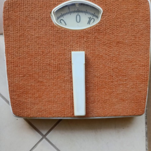 Vintage mechanical scale with carpet used