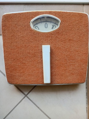 Vintage mechanical scale with carpet used