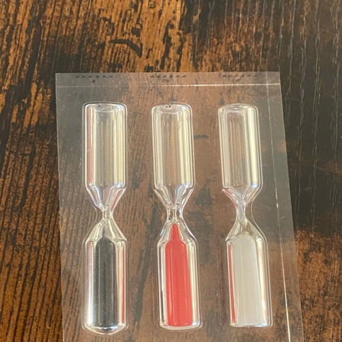 Hourglass with 3 time intervals (1, 2, and 3 minutes) used