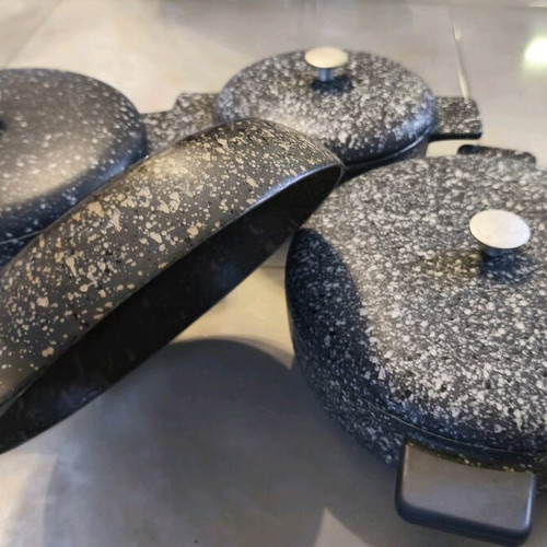 Heavy cookware set used with lids and large frying pan