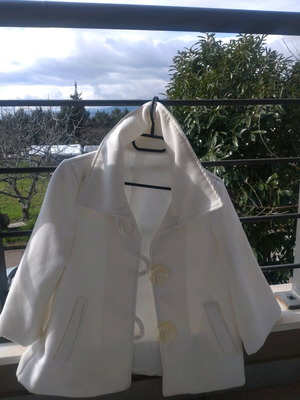 White jacket used, mid-length with 3/4 sleeves, 70% wool
