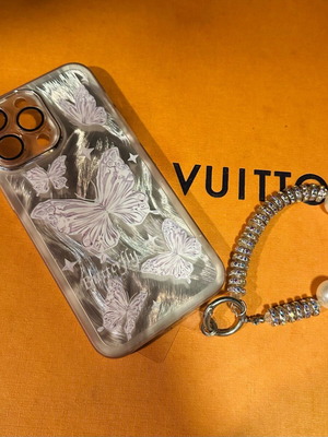 iPhone 14 Pro Max case with bracelet and silver butterflies like new
