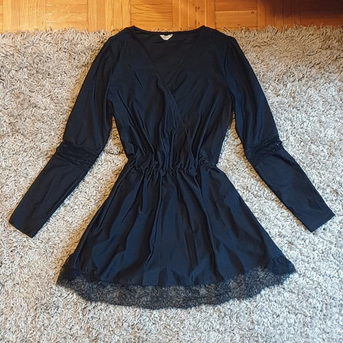 Black crossover dress used with delicate lace trim