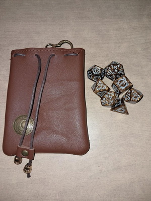 Brown leather dice bag with golden coffee D&D dragon dice