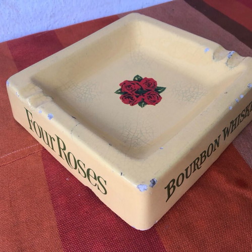 Four Roses porcelain ashtray used with cracks and chips