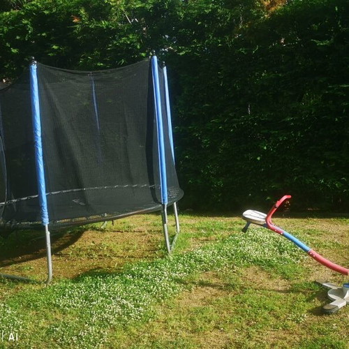 Playground set used with trampoline, seesaw, slide, and swings