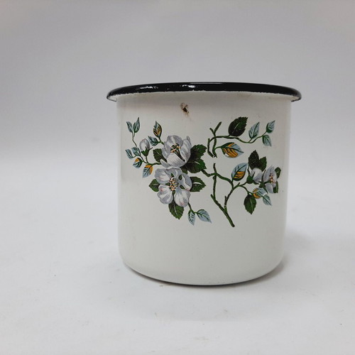 Vintage enamel metal mug with floral motif
