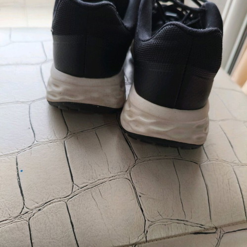 Nike shoes size 38.5 used, black with gold logo, athletic