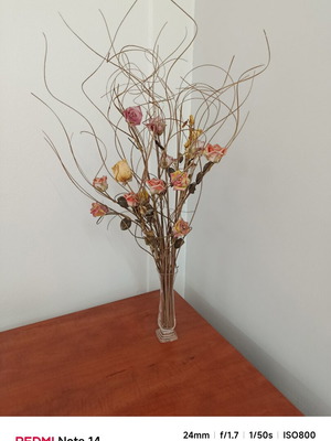 Vase with floral arrangement, pink base