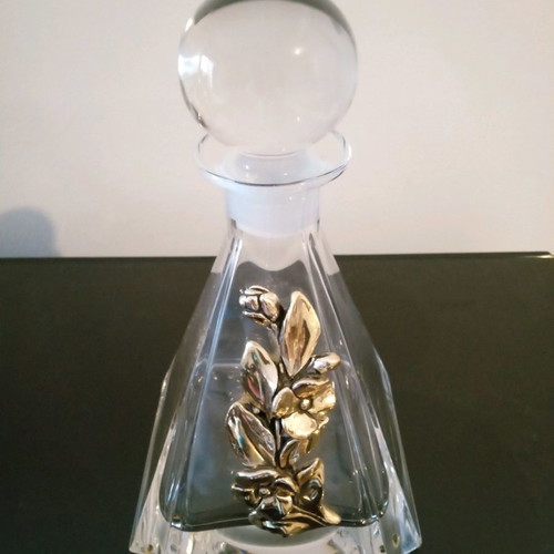 Crystal decorative bottle with silver design like new
