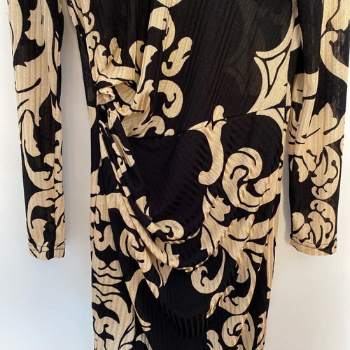 Dress with patterns like new, size large but tight fit, thin fabric