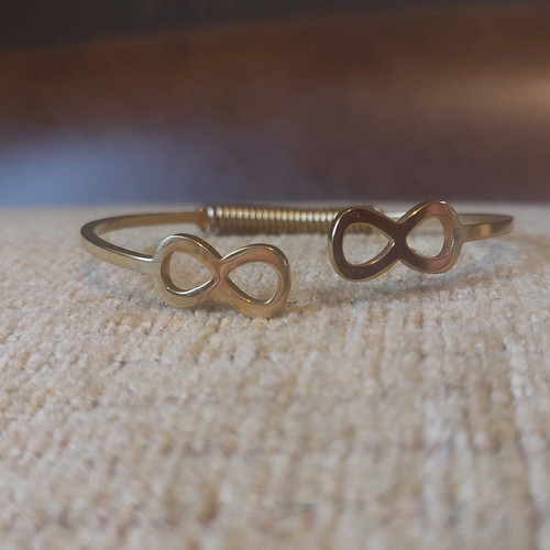 Gold infinity handcuff bracelet like new