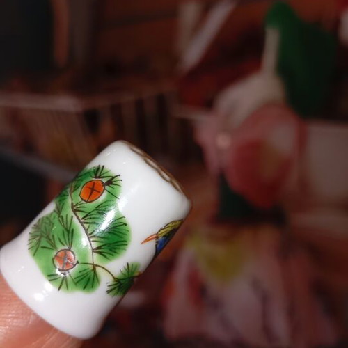 Porcelain thimble like new with bird design