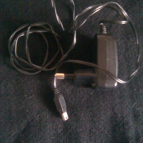 Motorola WX181 like new mobile phone with charger, headphones, and box