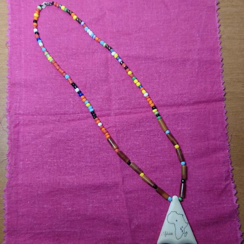 African necklace like new with cloth for storage or cleaning