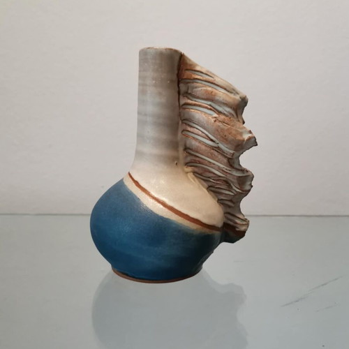 Handmade clay vase used with wavy finish