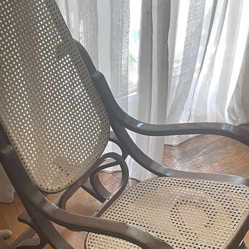 Wooden rocking chair with cane seat, walnut finish