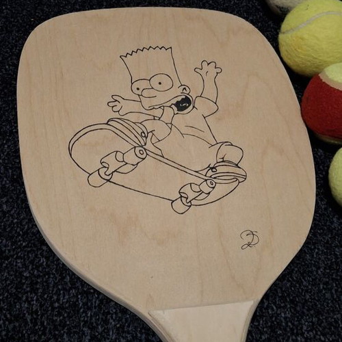 Wooden rackets and 5 balls like new, one custom painted