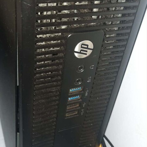 HP desktop computer with 24-inch monitor, keyboard, mouse and Logitech speakers