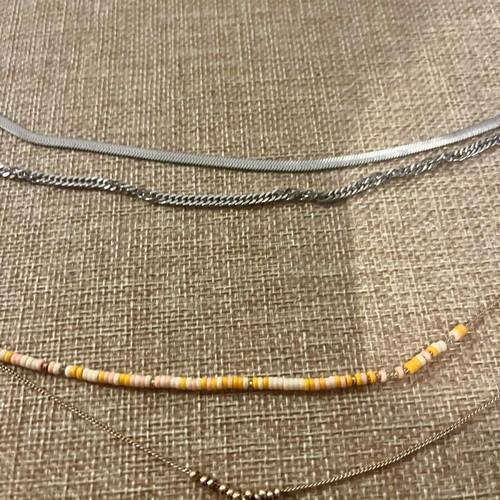 Necklaces with double chain like new, silver and gold with stones