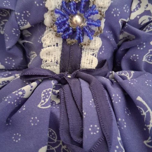 Vintage Slavic doll with porcelain head and fabric body