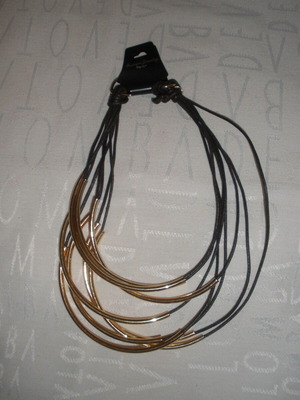 Women's jewelry set with gold-tone metal elements, boho-minimalist style