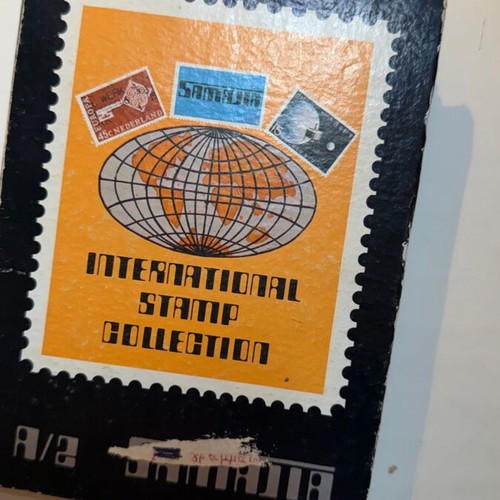 International Stamp Collection album with large vintage Greek and foreign stamps lot