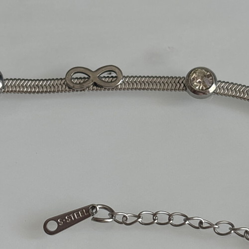Steel bracelet new, silver with rhinestones and infinity