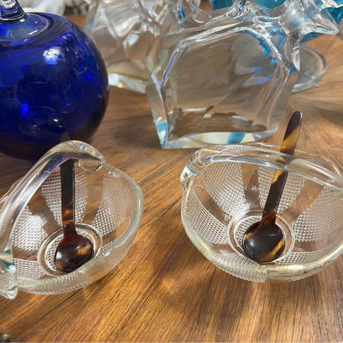 Two small glass baskets with spoon for caviar used