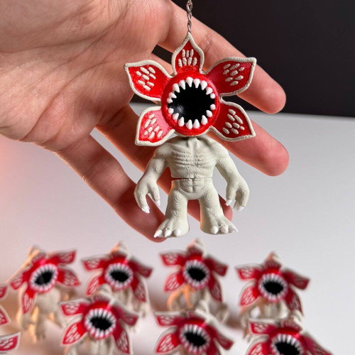 Demogorgon keychain with moving parts and Stranger Things logo like new