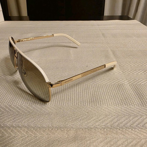 Gucci sunglasses used, white and gold