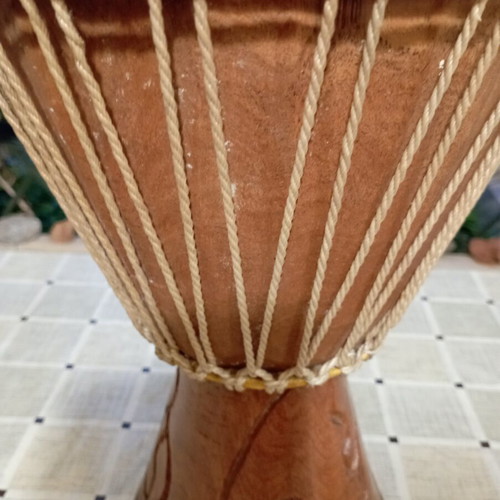 Traditional African djembe drum, carved wood and natural skin