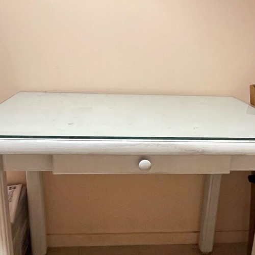 Wooden desk with glass surface and drawer used