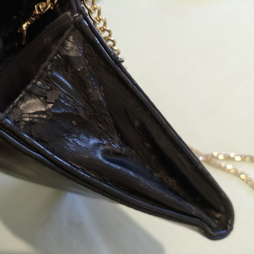 Black clutch bag with gold chain used, synthetic leather