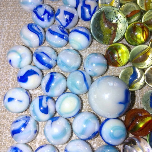 Collection of 68 used glass marbles in various sizes