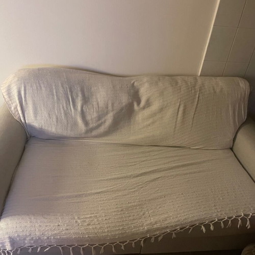 Two-seater sofa like new with wooden legs and large back cushions