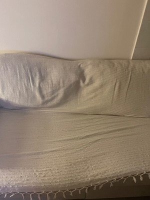 Two-seater sofa like new with wooden legs and large back cushions