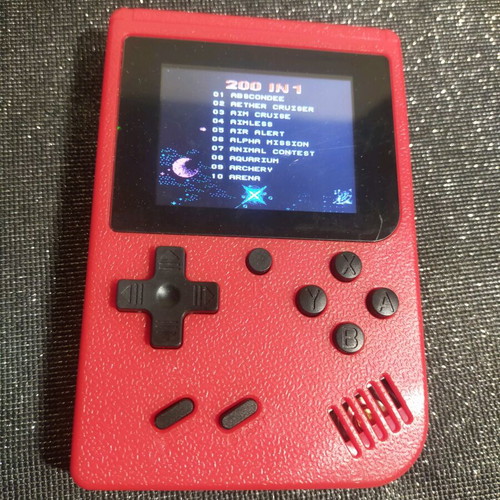 Retro style handheld game console used, working