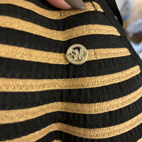Steve Madden bucket hat with striped design and adjustable opening for ponytail